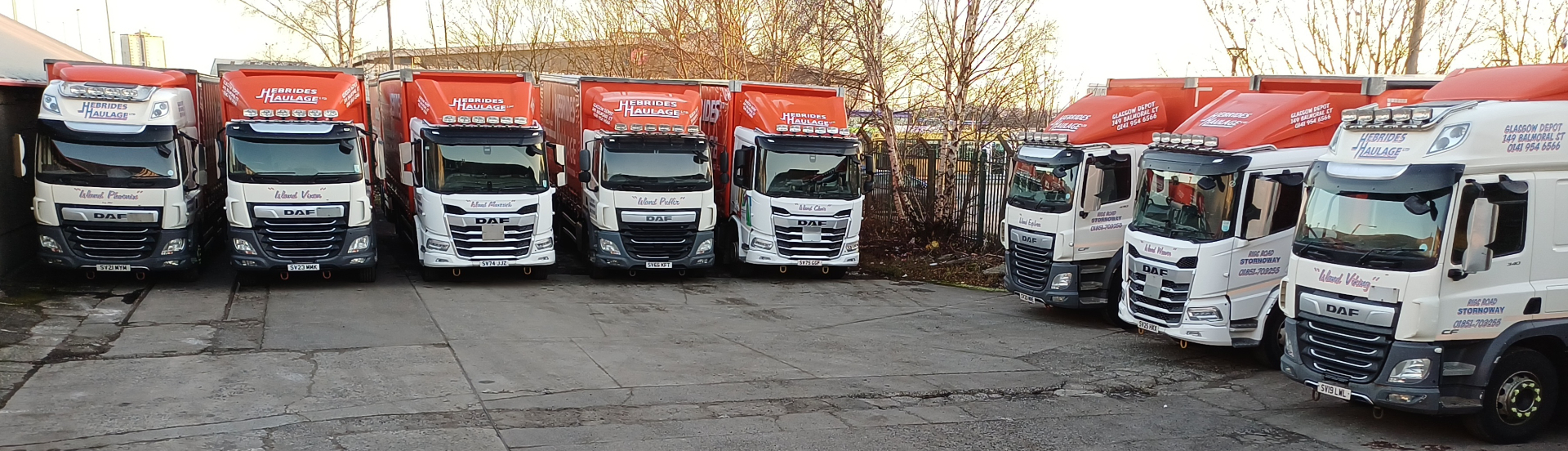Full Hebrides Haulage DAF fleet lined up at the Glasgow depot yard